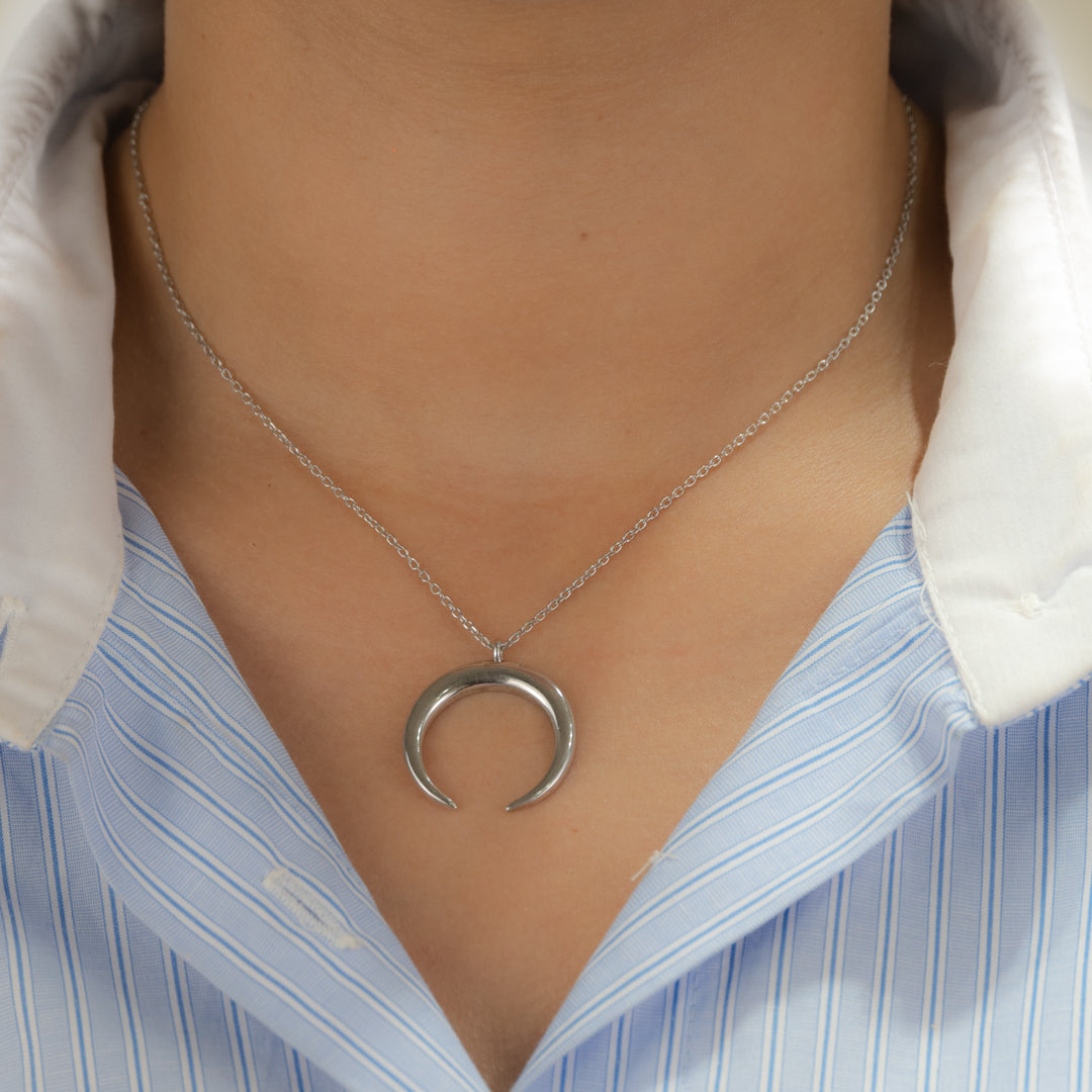 PLAIN TURNED CRESCENT SILVER NECKLACE